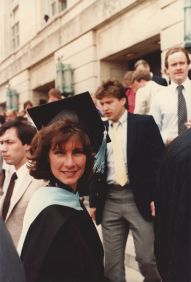 Sara Ashworth in her cap and gown receiving her Doctorate